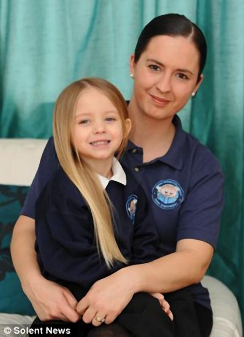 The boy gives her long hair to charity