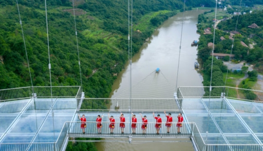 China has opened the suspended glass bridge and immediately set several world records