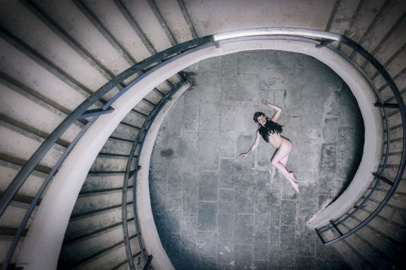 Guy photographing his girlfriend in an abandoned locations across Europe