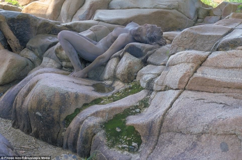 Look for the woman: naked models blend in with the scenery
