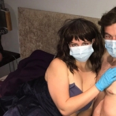 Safe sex: British woman with coronafobia making love only in a mask and gloves