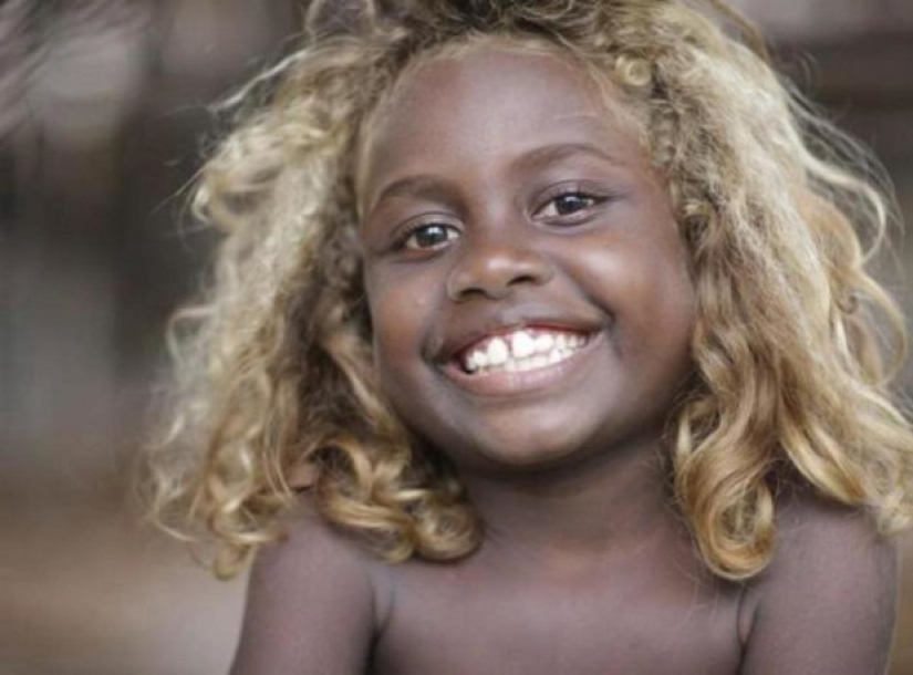 Where in Melanesia come from dark-skinned people with blond hair