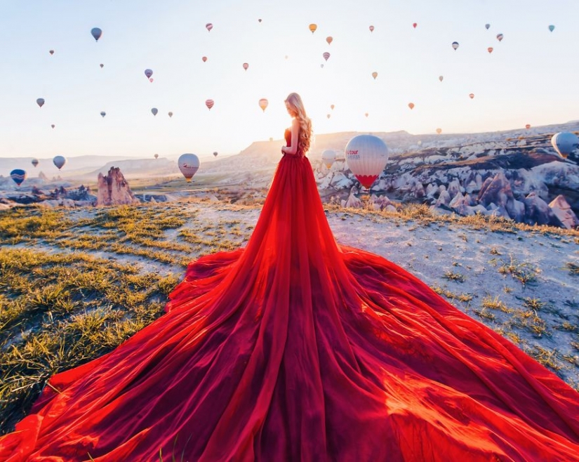 Girls in dresses perfectly matched to the landscape background
