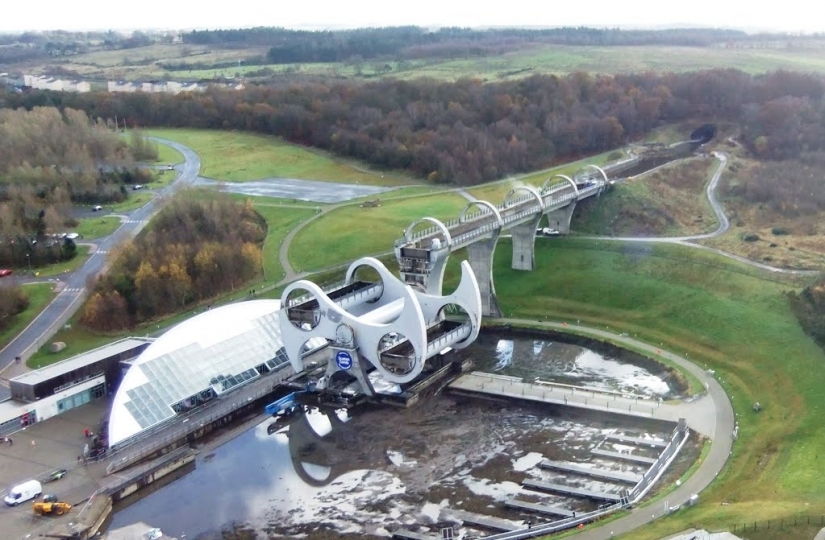 The Falkirk Wheel is a unique rotating structure that lifts entire ...