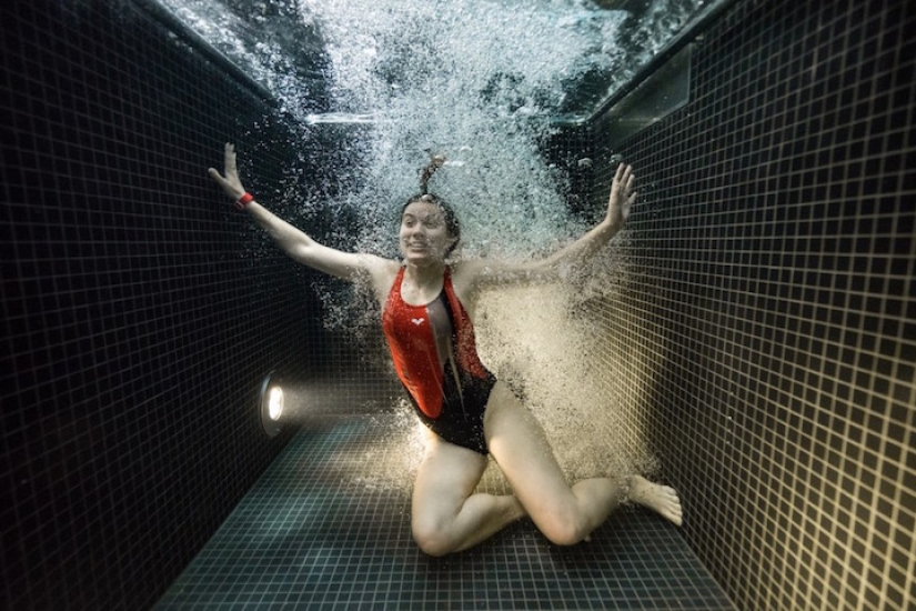 Underwater portraits of people who dived into a pool of icy water
