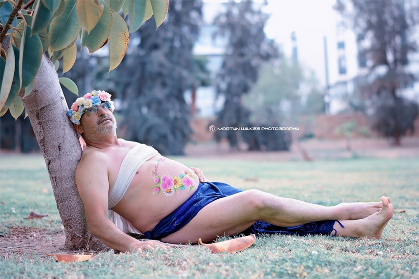 A father of two children with a "beer belly" staged a parody of a typical pregnant photo shoot