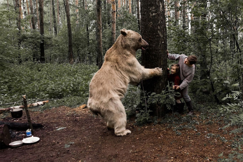 A Russian family befriended a bear in the forest for an anti-hunting campaign
