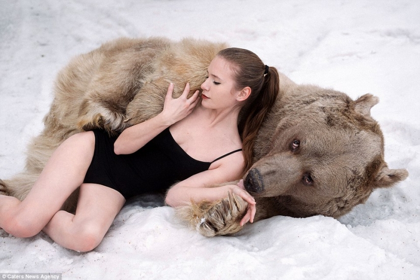 A snowy photo shoot of two models from Russia in an embrace with a bear shocked Europe
