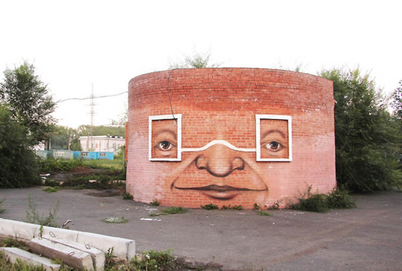 Caras en edificios por Nikita Nomerz