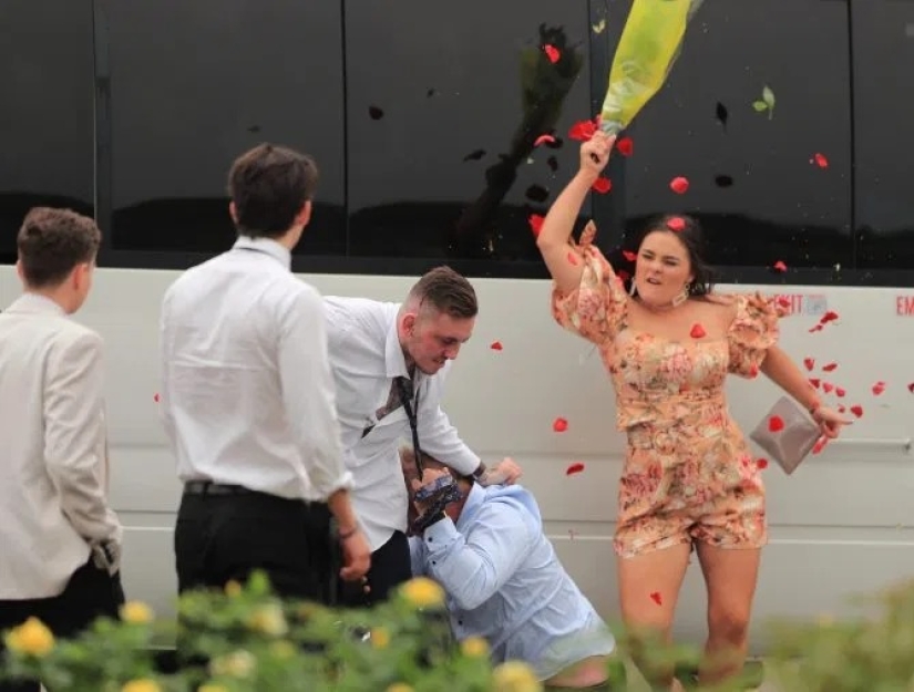 Don't wake the beast in her: a girl whipped a bully with a bouquet during a mass brawl at a horse race in Australia