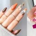 Estado de ánimo "otoño": 10 hermosos ejemplos de manicura con estampados florales, con hojas, bayas y flores.