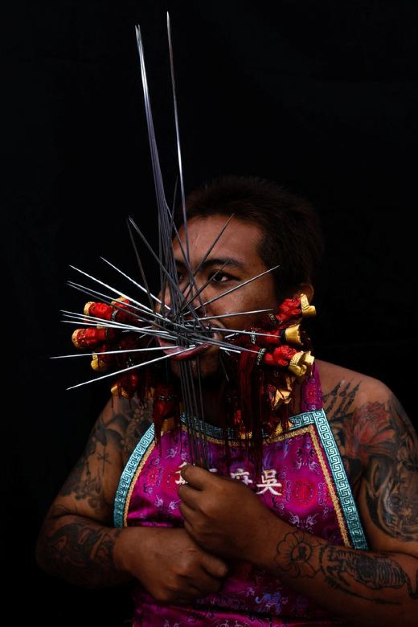 Extreme piercings put devotees in soul-cleansing trance at Thai festival