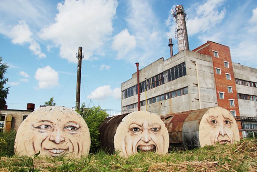 Faces on buildings by Nikita Nomerz