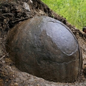 Huge stone ball in the middle of the forest