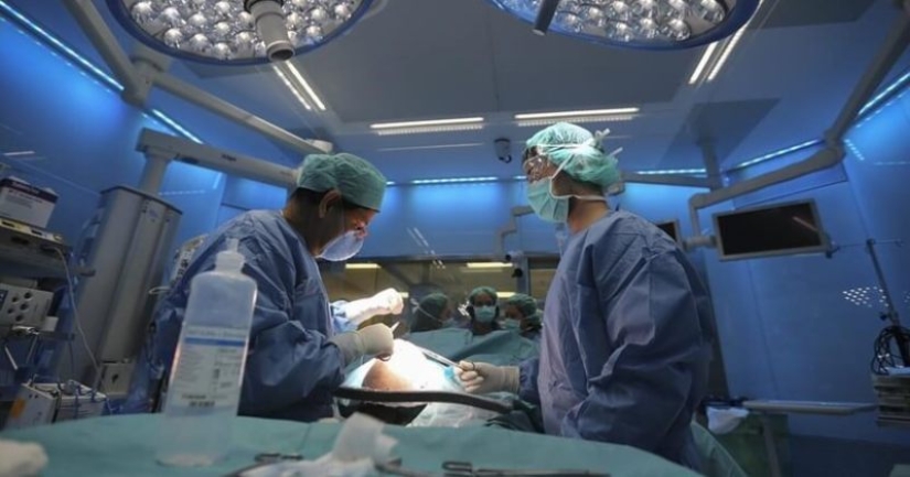 In the UK, the license of a surgeon who burned initials on the liver of patients was revoked