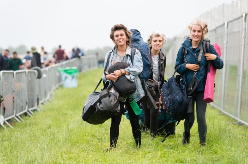 Rubber mood: Glastonbury greets participants in raincoats and with a killer dose of alcohol