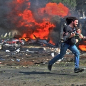 Syrian photographer received 120 thousand dollars for a picture of a colleague rescuing a wounded child