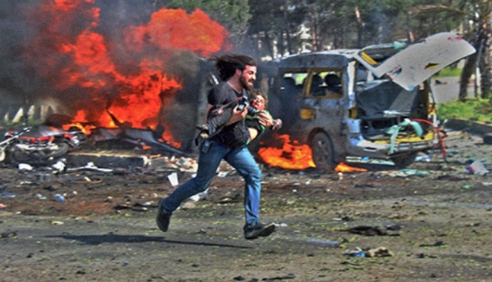 Syrian photographer received 120 thousand dollars for a picture of a colleague rescuing a wounded child