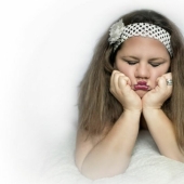 The idea for a photo shoot: a 34-year-old mother of three children in the role of a baby in a diaper