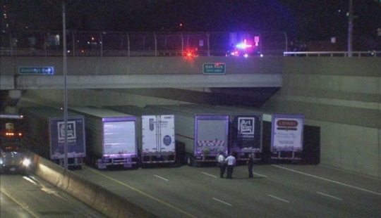 Trucks lined up under the bridge to prevent suicide