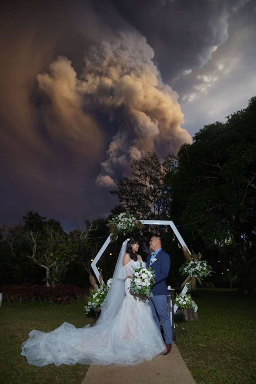 Wedding ceremony against the backdrop of an erupting volcano in the Philippines