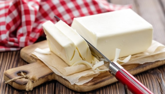 What is a spread and how does it differ from butter and margarine