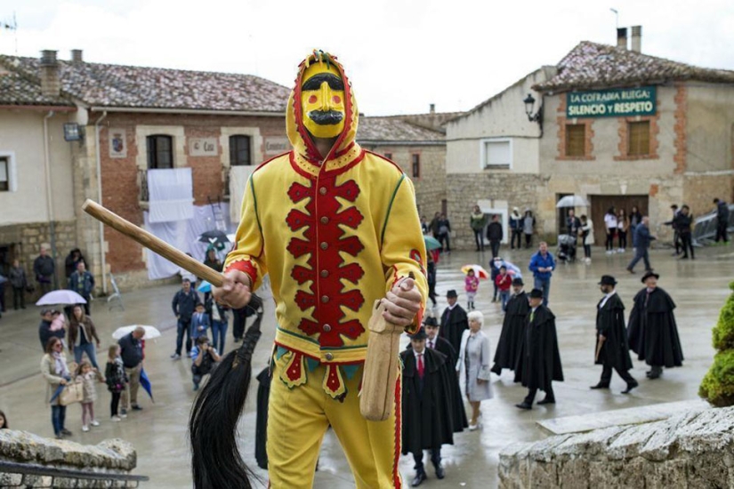 Why do Spaniards dress up as demons and jump over babies