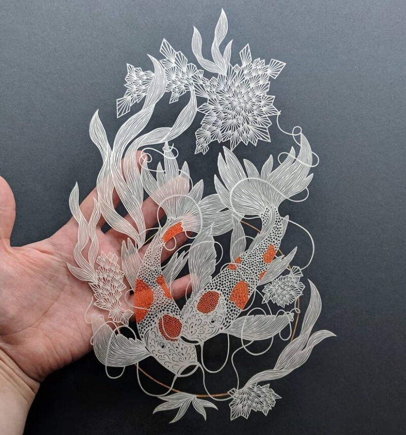 A girl cuts out intricate masterpieces from paper
