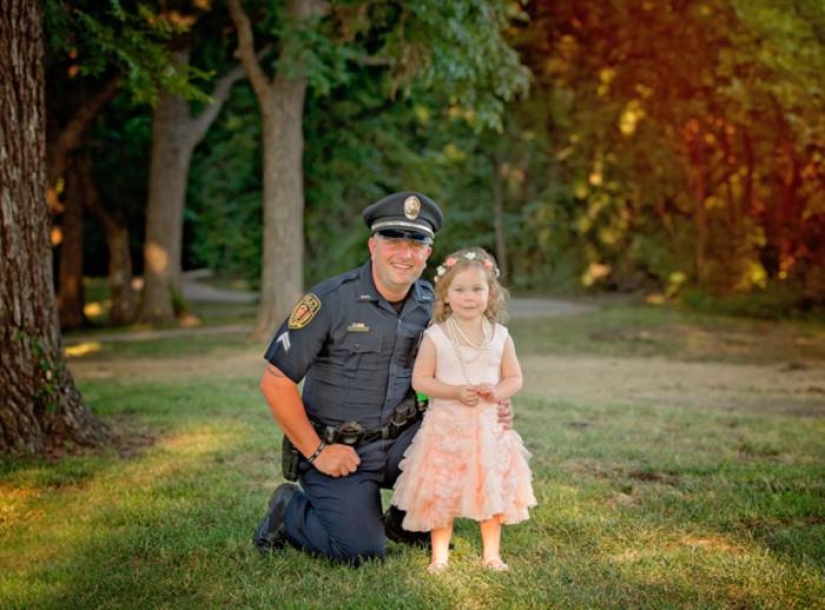 A policeman starred in a cute photo shoot with a girl he saved from death