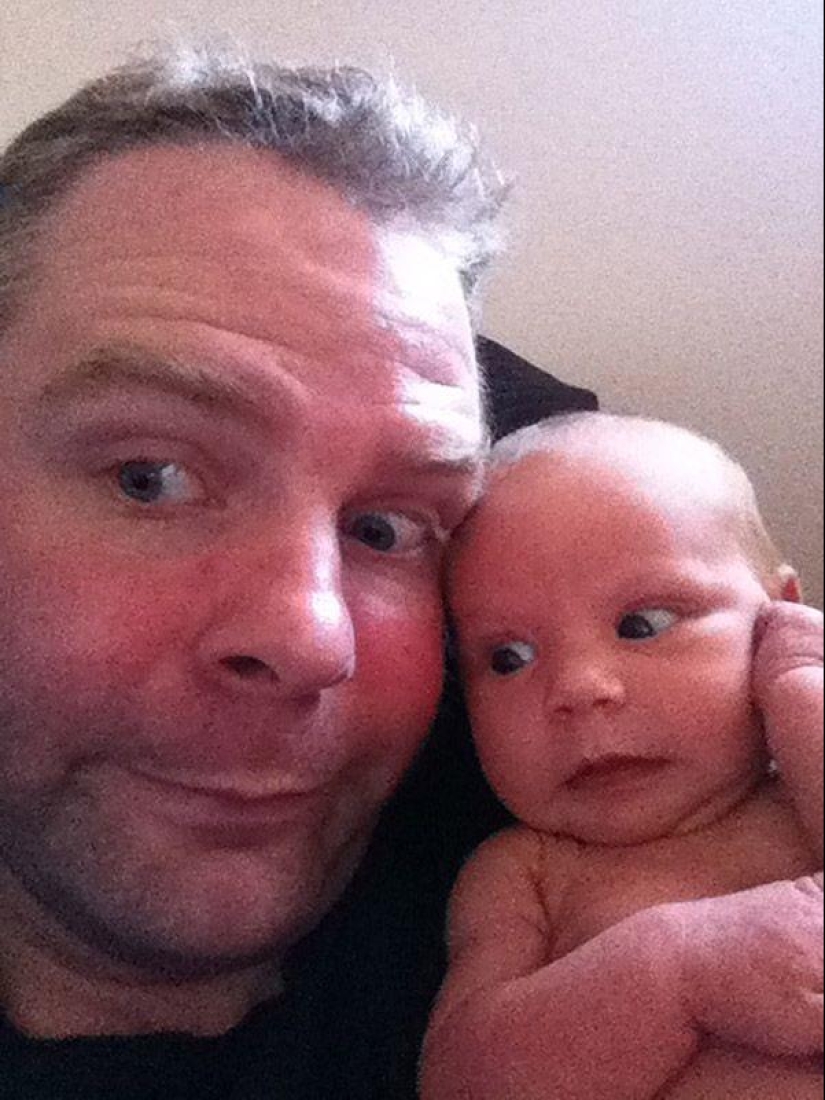 Apple from an apple tree: a young father is photographed with a newborn daughter