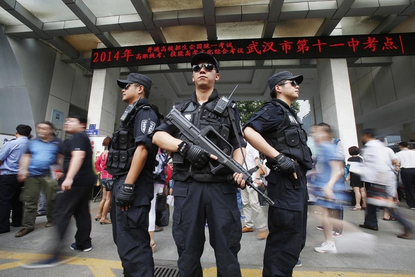 Chinese police showed devices that applicants tried to use to pass exams