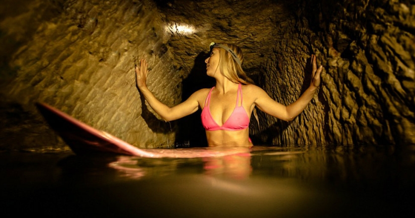Indiana Jane: An American woman on a surfboard explores the skeletal catacombs of Paris