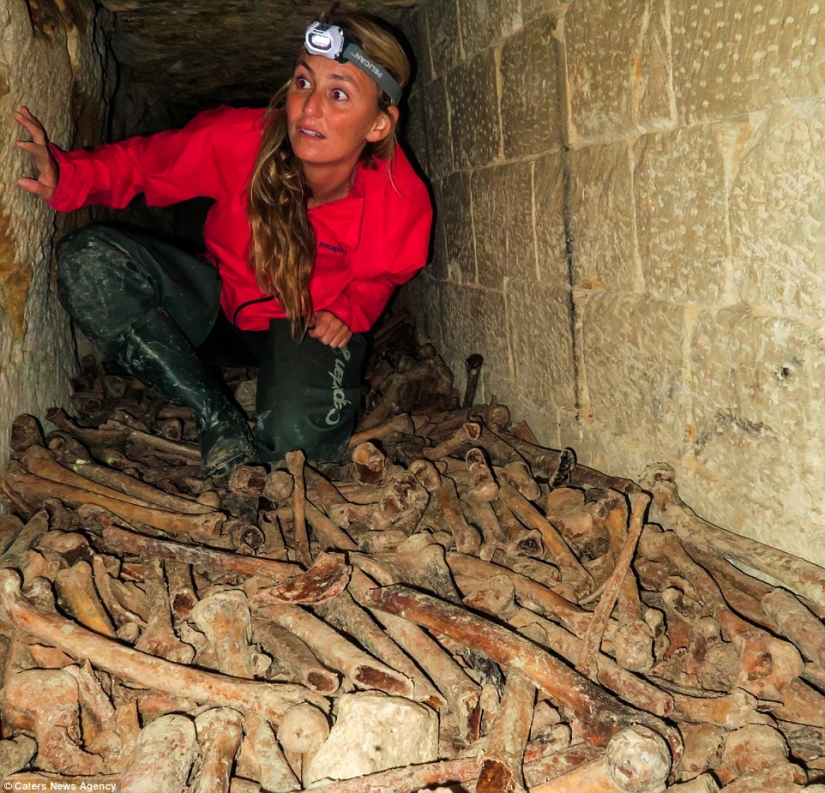 Indiana Jane: An American woman on a surfboard explores the skeletal catacombs of Paris
