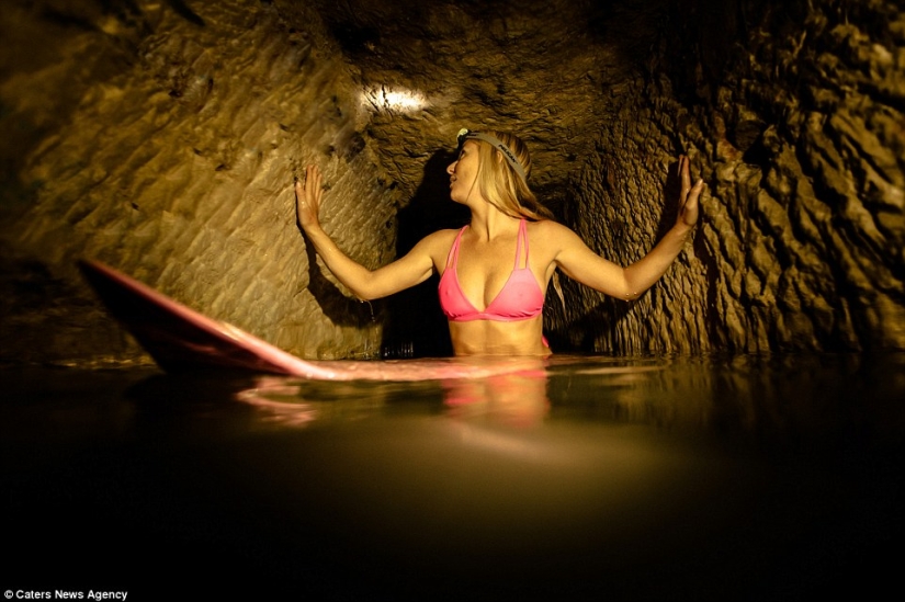 Indiana Jane: An American woman on a surfboard explores the skeletal catacombs of Paris