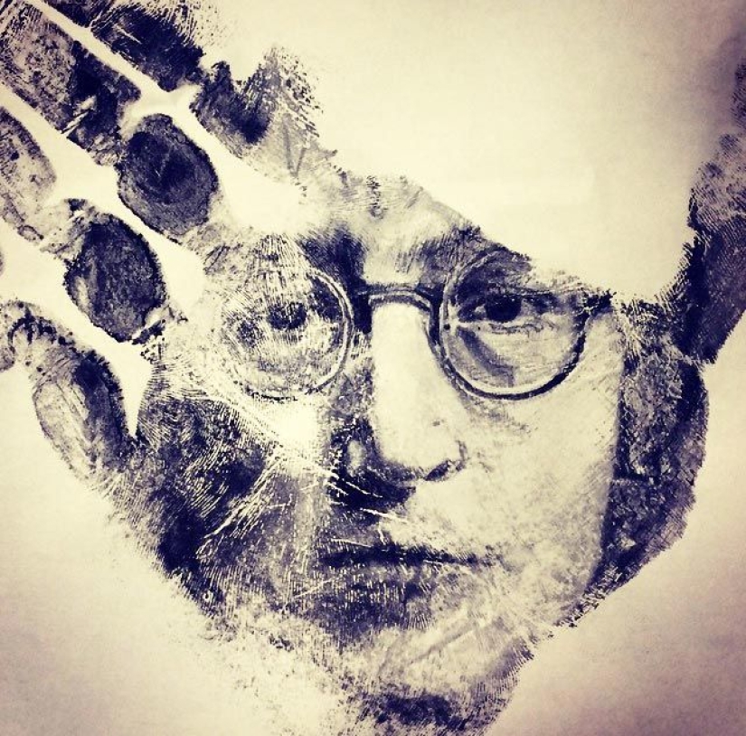 School teacher draws breathtakingly realistic portraits on the palms of his hands and uses them as a stamp