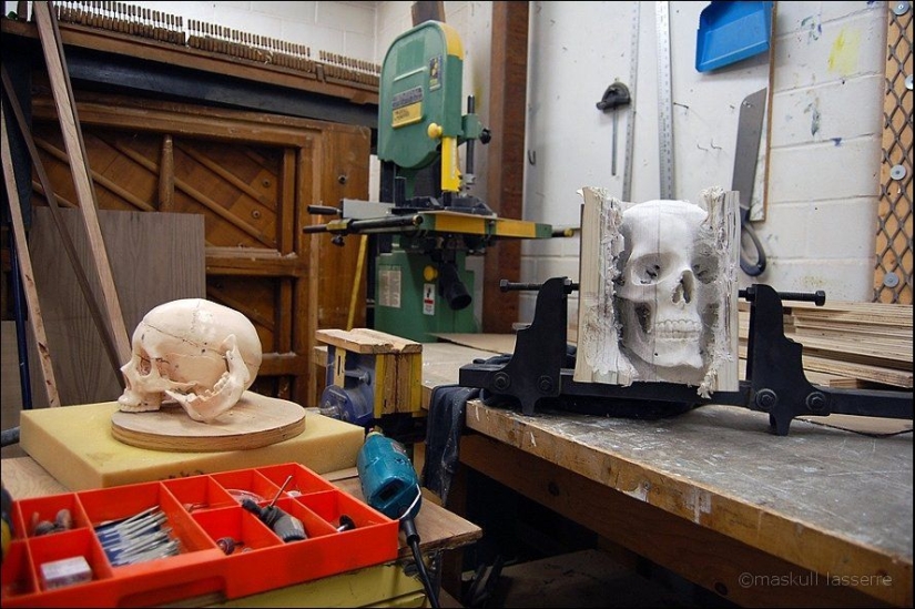 Step-by-step process of carving a skull from old books