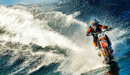 Surfing legend: Robbie Maddison rides a wave on a motorcycle Surfing legend: Robbie Maddison rides a wave on a motorcycle
