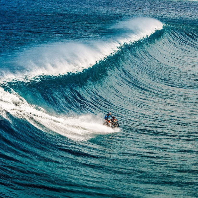 Surfing legend: Robbie Maddison rides a wave on a motorcycle
