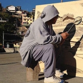 The artist draws with a magnifying glass and sunlight