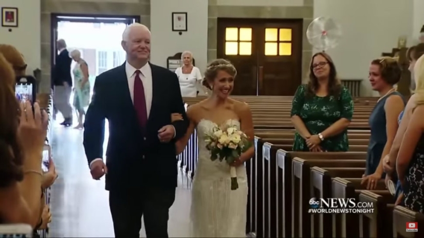 The bride was escorted to the altar by a man who had her father's heart transplanted