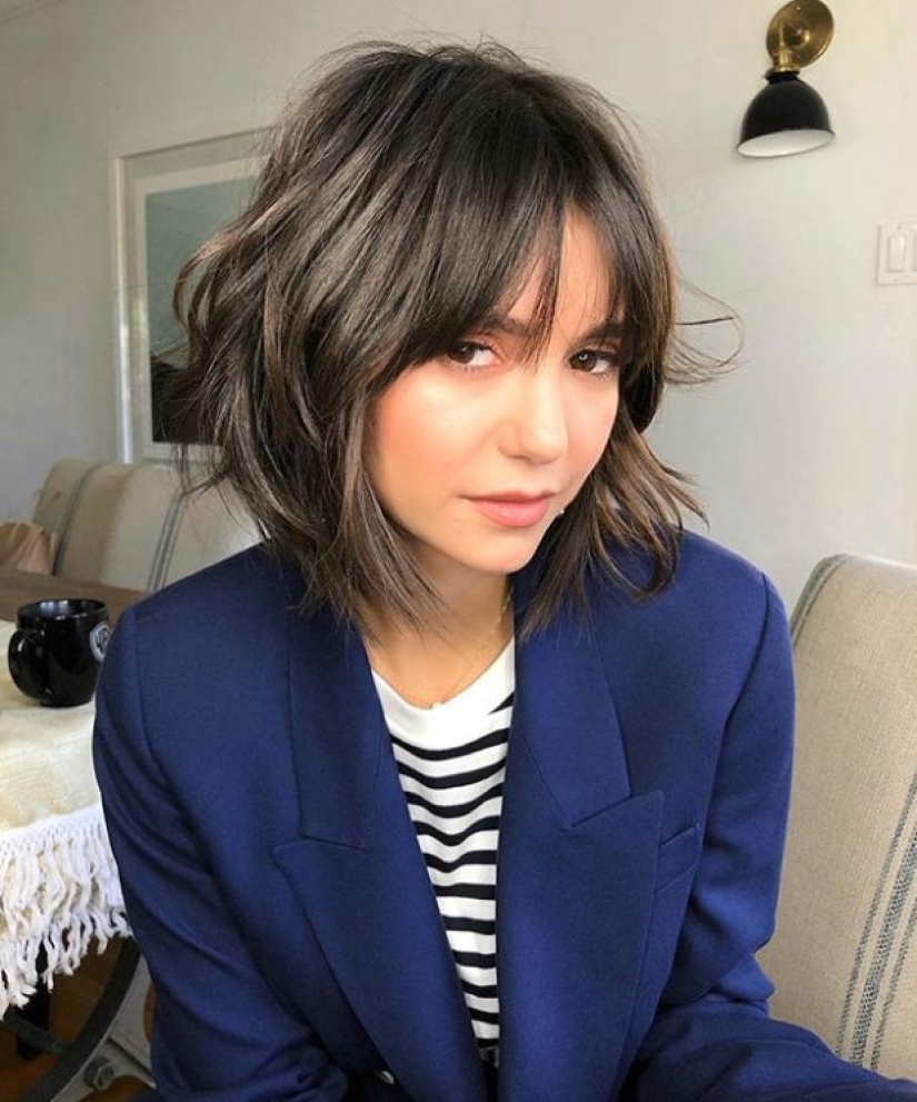 Trendy haircuts 2023: layering, short length and bangs