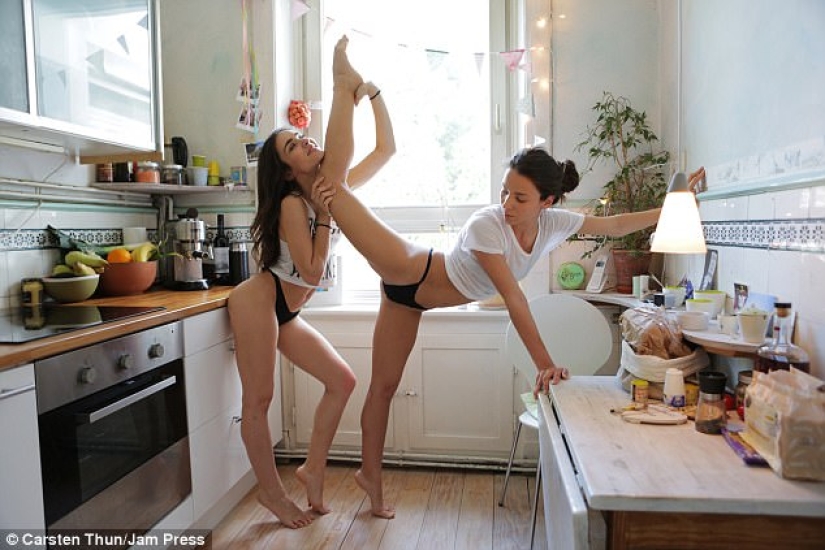 Two twin dancers showed stretching in a playful morning photo shoot