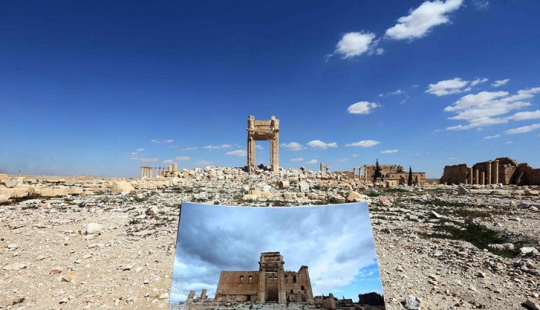 What happened to the centuries-old monuments of Palmyra after ISIS