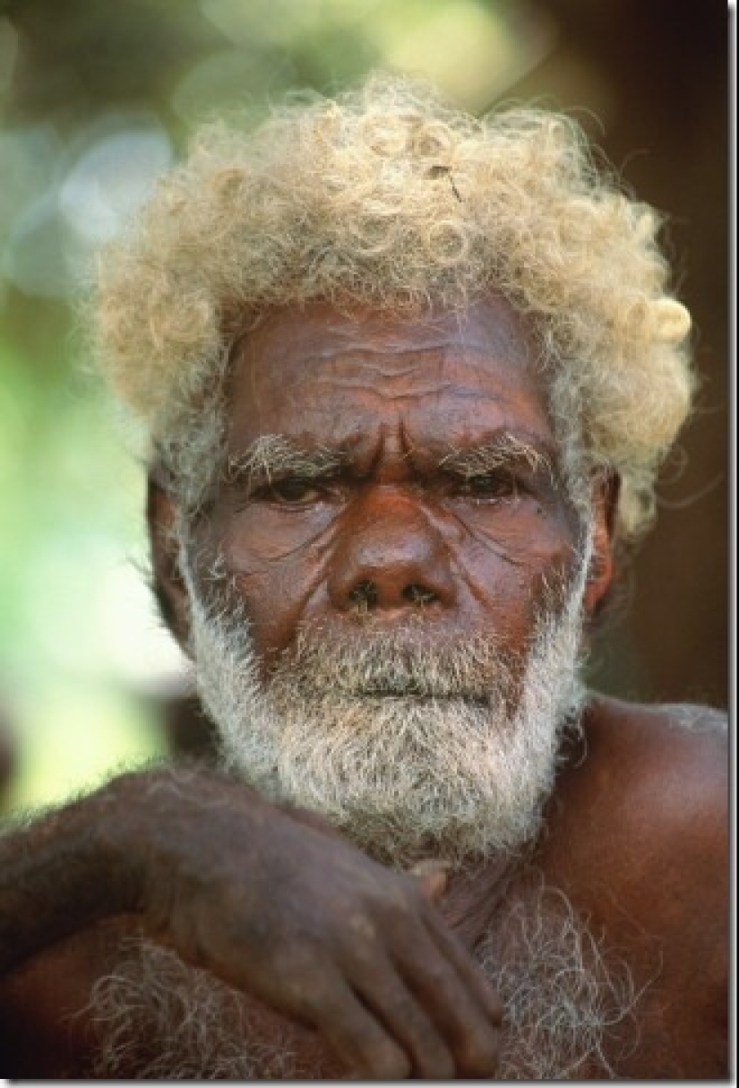 Where did dark-skinned people with light hair come from in Melanesia