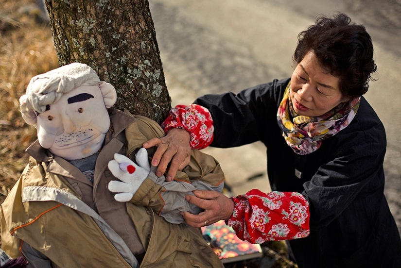 Why do 35 people and 150 stuffed animals live in a Japanese village?