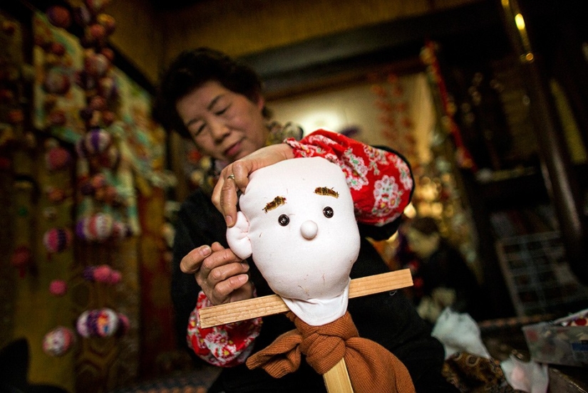 Why do 35 people and 150 stuffed animals live in a Japanese village?