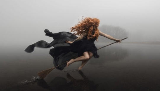 Why were witches depicted riding a broom?