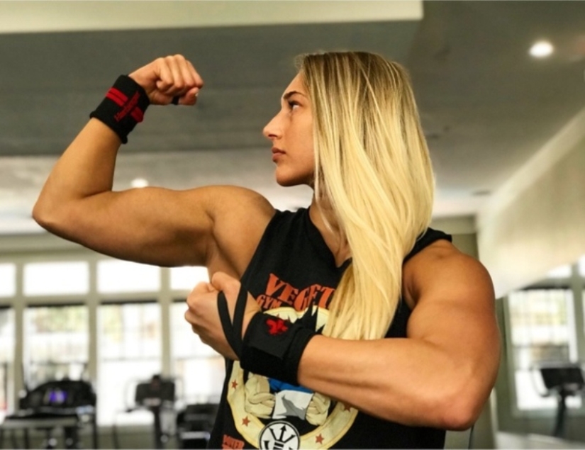 Wrestler Rhea Ripley and her two sides - a beast in the ring and a cutie in real life