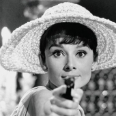 20 famous girls with guns in their hands