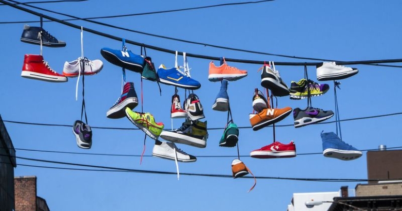 6 theories explaining the strange custom of hanging shoes on wires